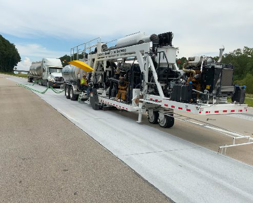 A truck is parked on the side of the road.