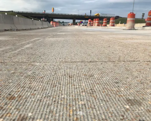 A view of an empty road with the bridge in the background.